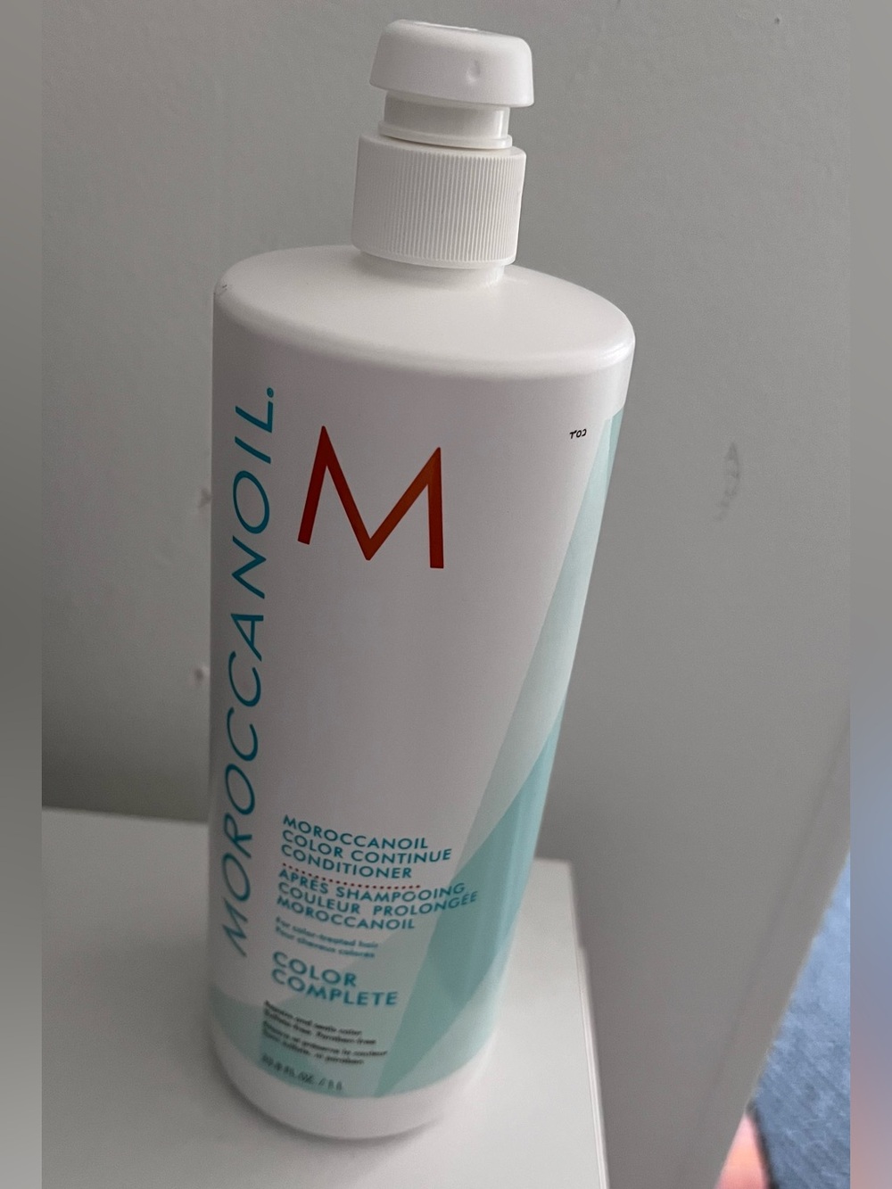 Moroccanoil White and Teal Color Complete Conditioner Bottle